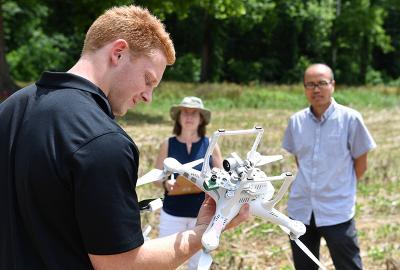 Andrew Broecker, VMI Class of 2022, prepares to fly a drone while Dr. Hongbo Zhang looks on.—VMI Photo by Kelly Nye.